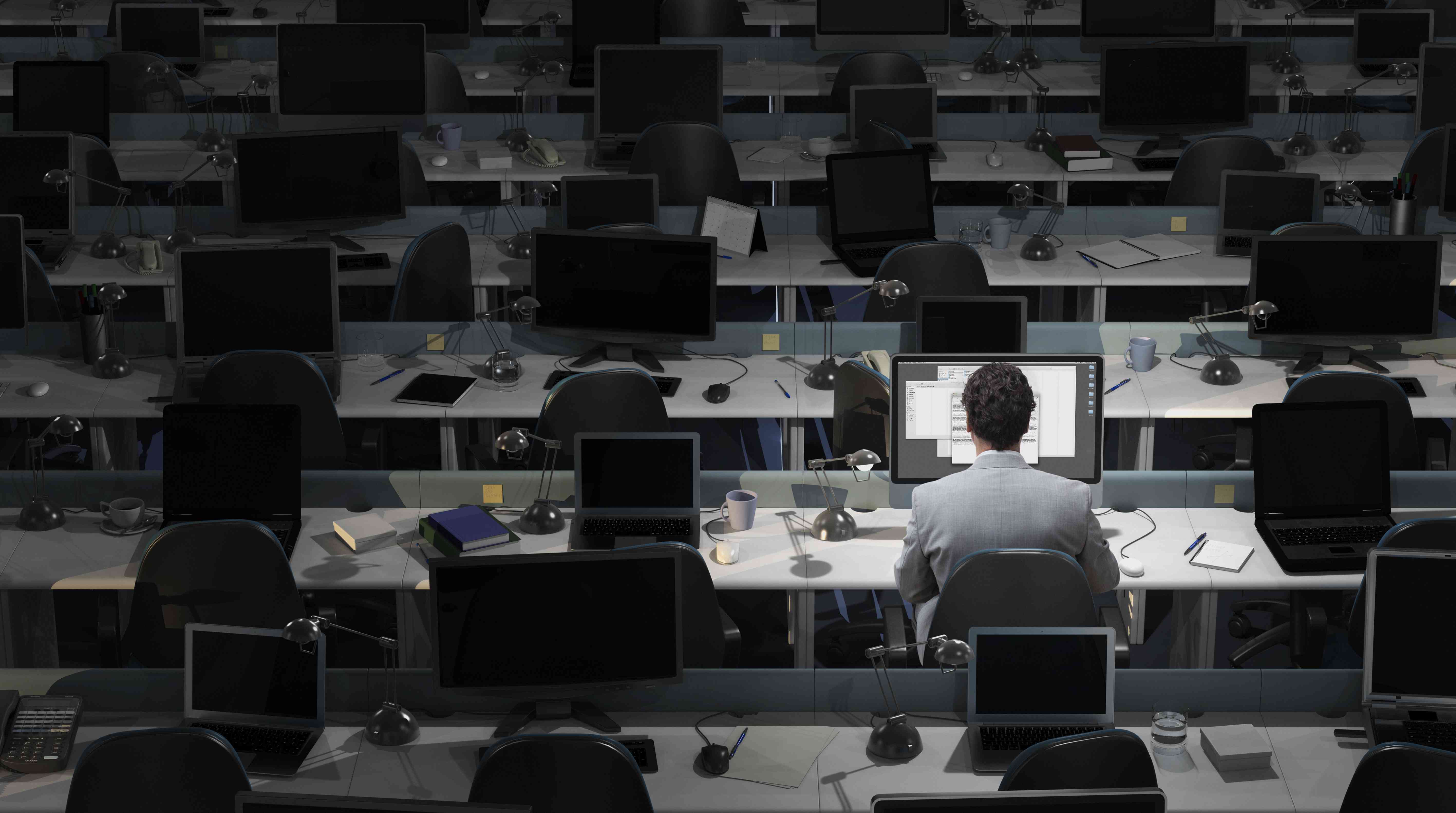 A worker in a sparsely occupied office