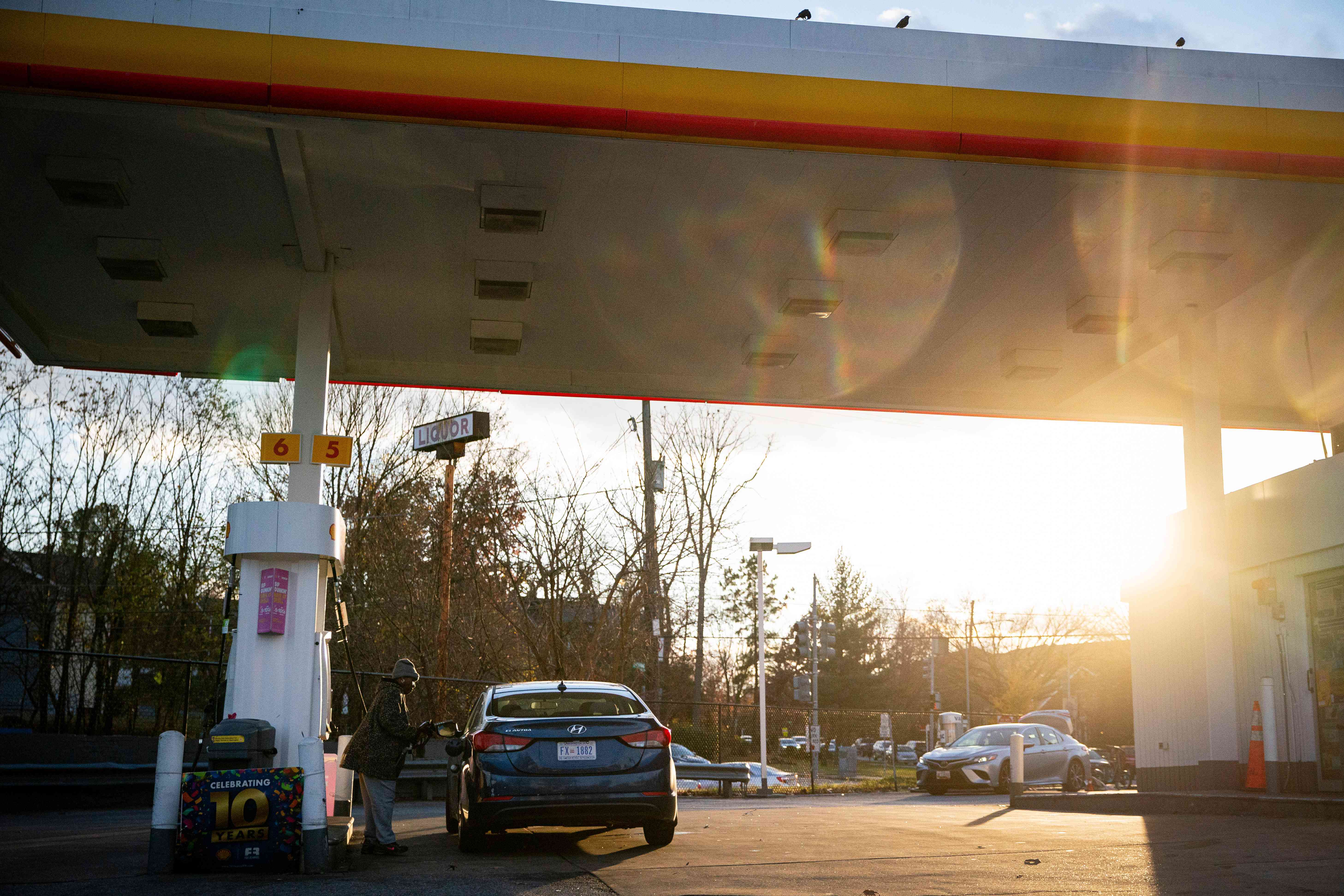 A driver pumps gas at a Shell gas station in Washington, DC, US