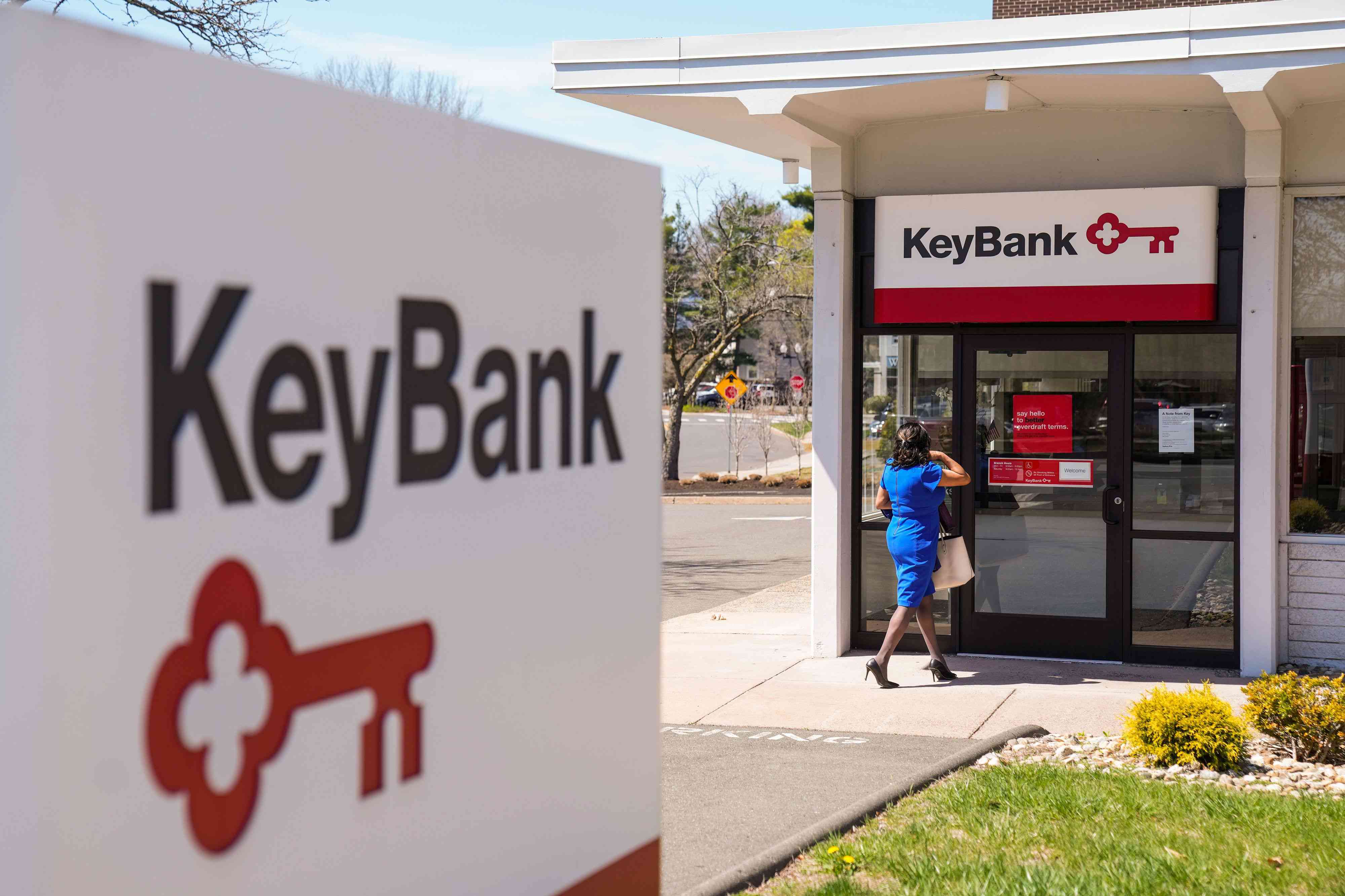 Woman walking into a KeyBank branch in West Hartford, Connecticut